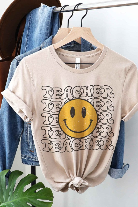 HAPPY FACE TEACHER REPEAT GRAPHIC TEE